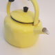 Old kettle enamelled pale yellow
