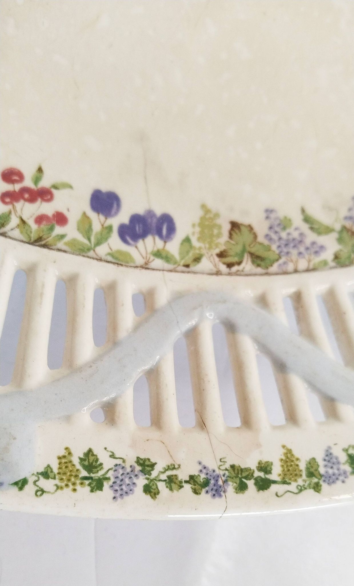 Oval dish in openwork earthenware from Sarreguemines, blue ribbon and fruit