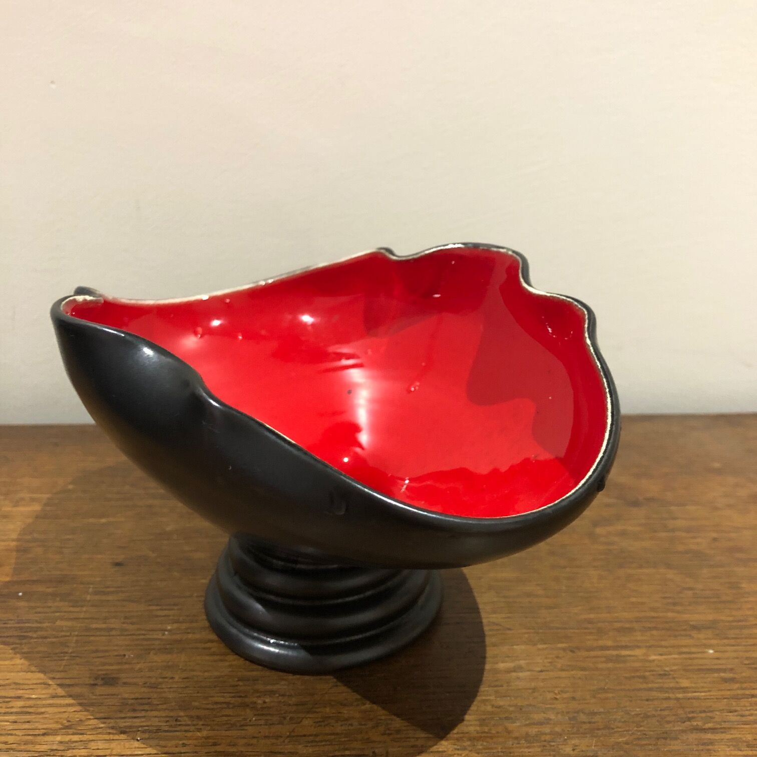 Red and black trinket bowl of the 50s