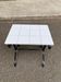 Vintage black wrought iron side table with white ceramic.