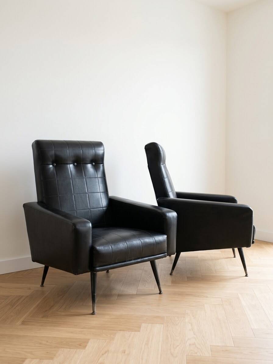Pair of vintage 70s armchairs in black faux leather.