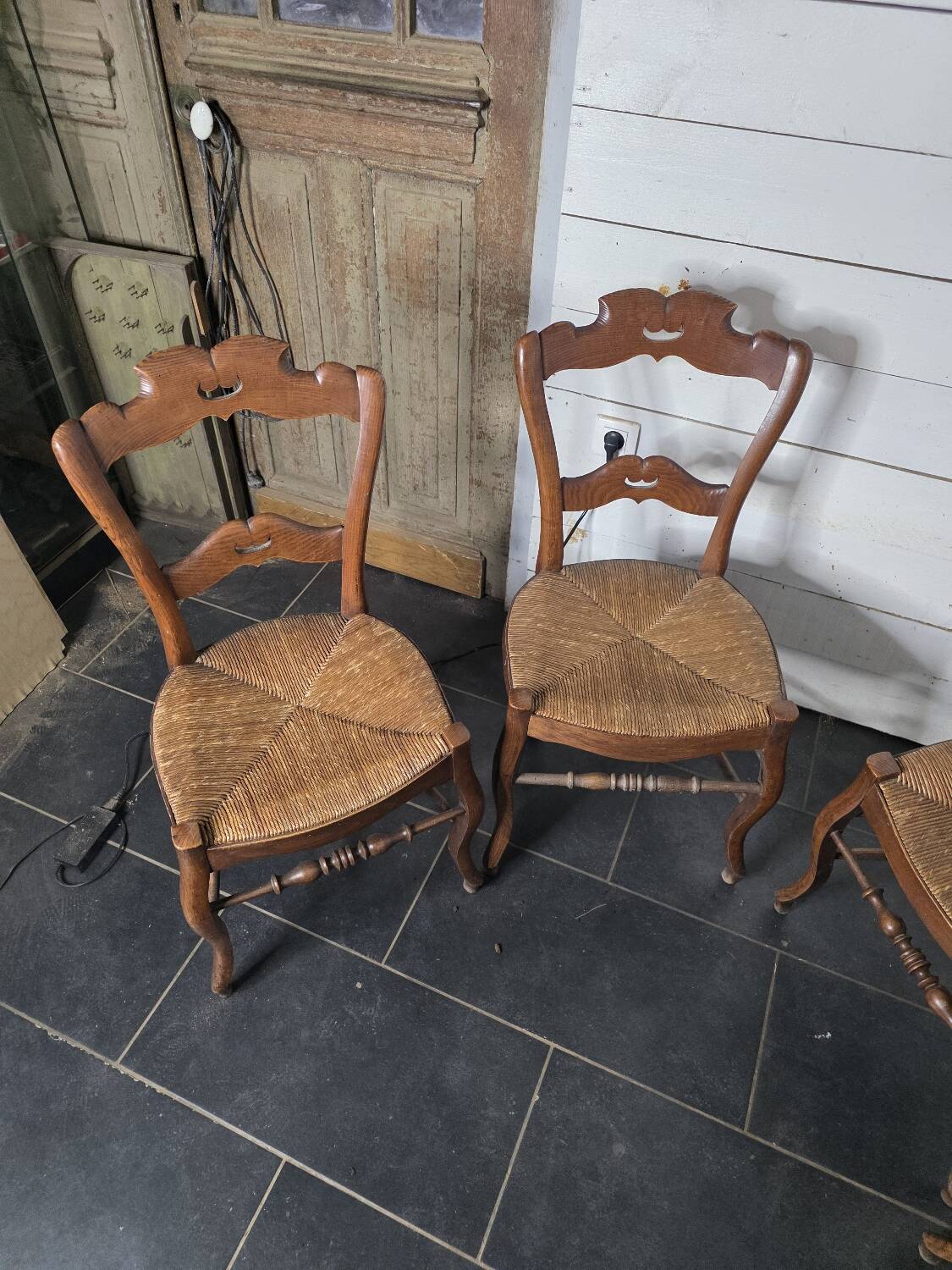 4 old straw chairs