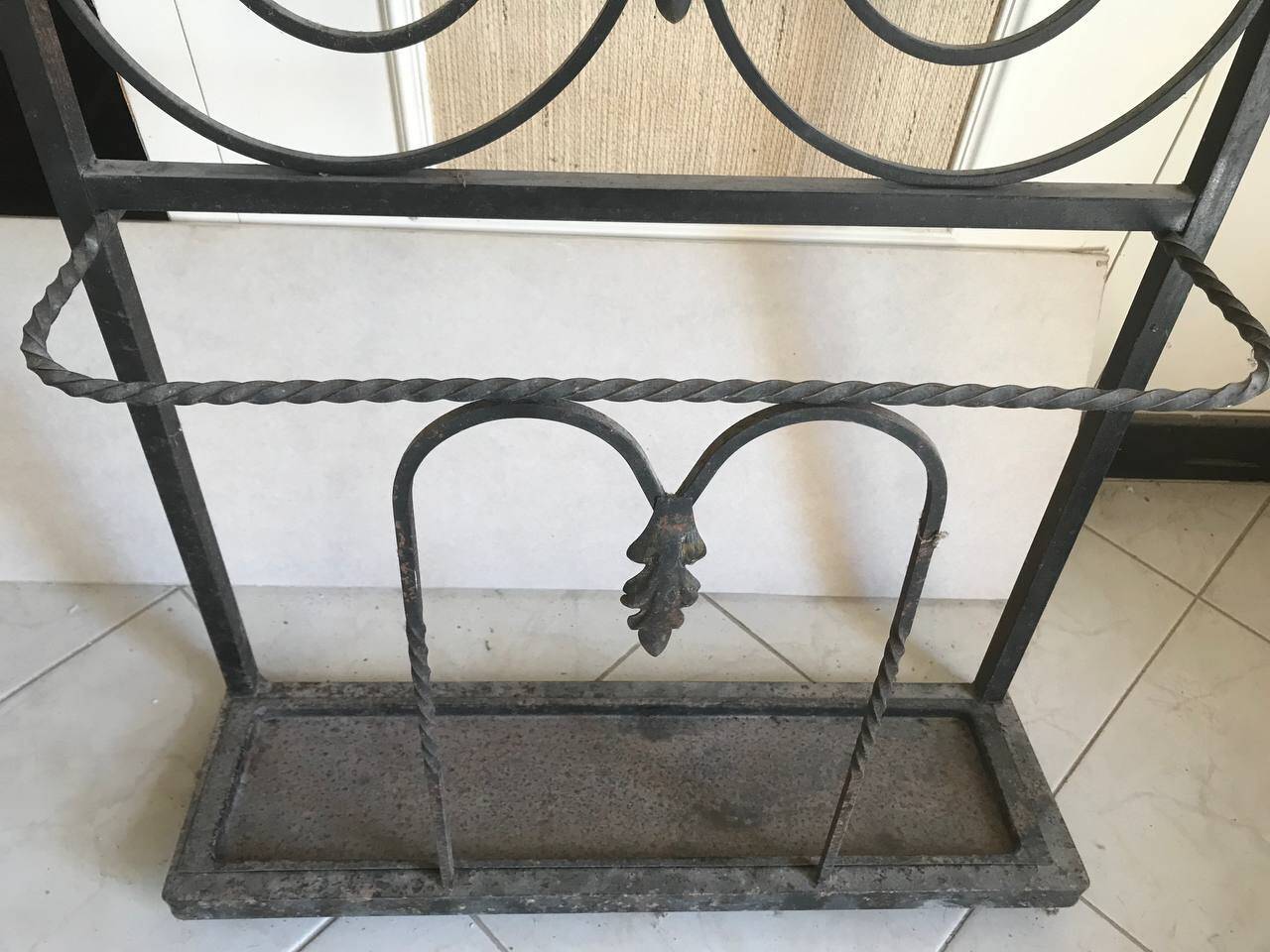 Wrought iron coat rack and shelf