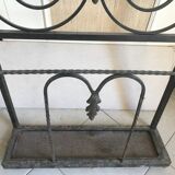 Wrought iron coat rack and shelf