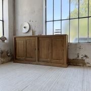 Large row of solid oak loom sliding doors