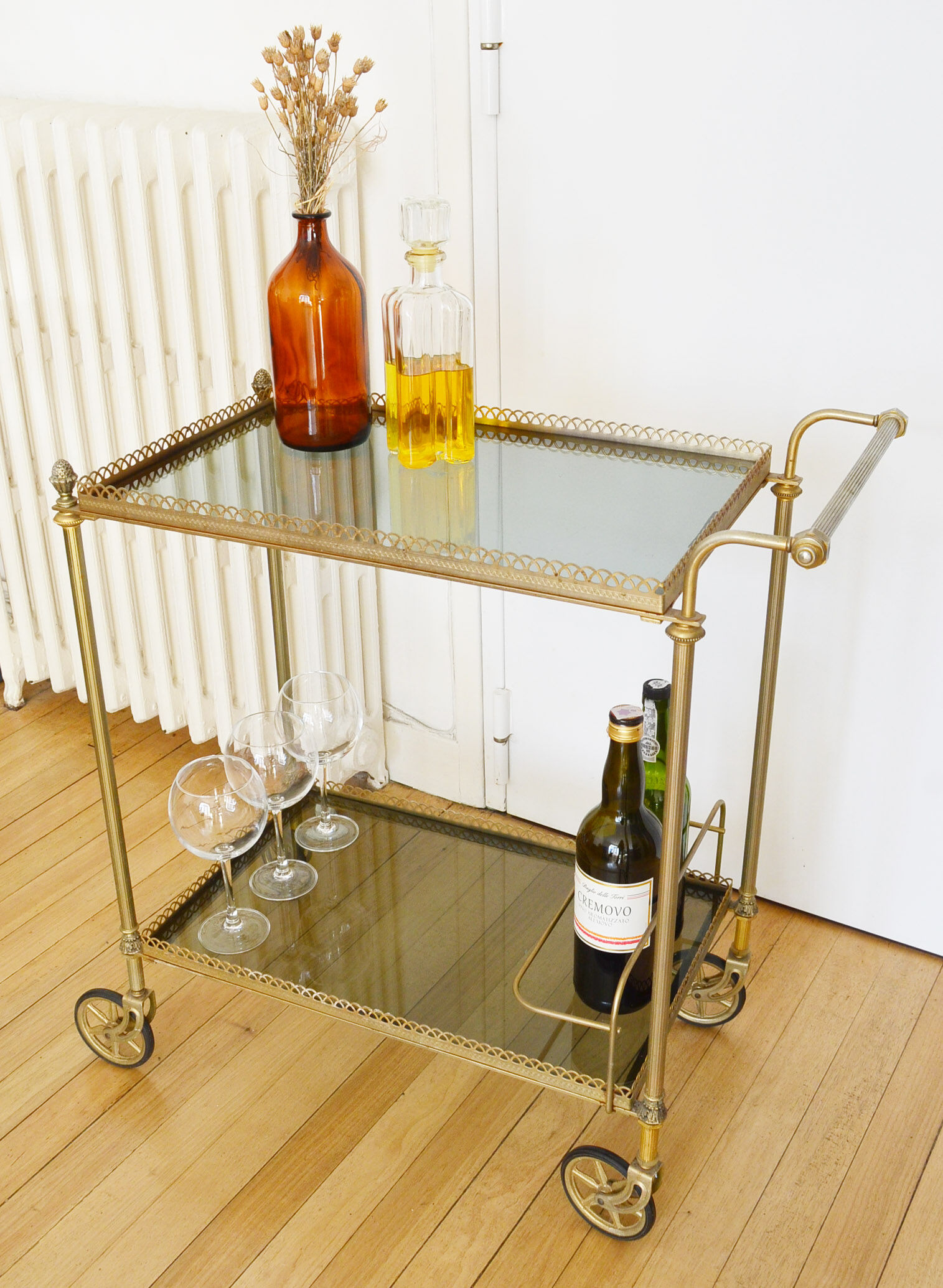 Glass and gold metal wheeled serving table 1960