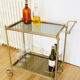 Glass and gold metal wheeled serving table 1960