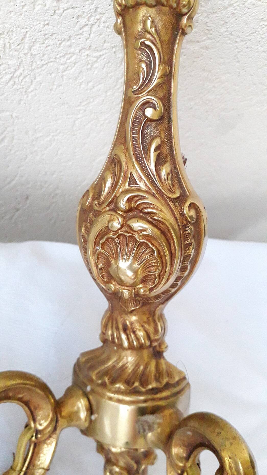 pair of bronze wall lights with pendants