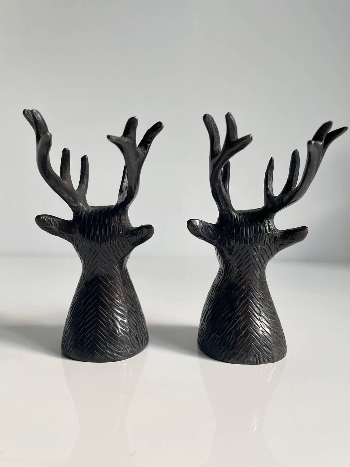 Salt and pepper shaker set with patinated brass deer heads.