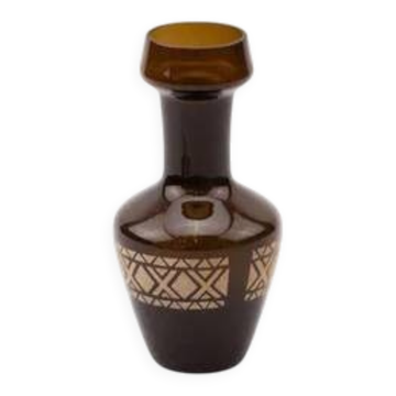 Vintage brown glass vase with golden geometric patterns.
