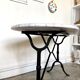 Bistro table in gray marble and cast iron