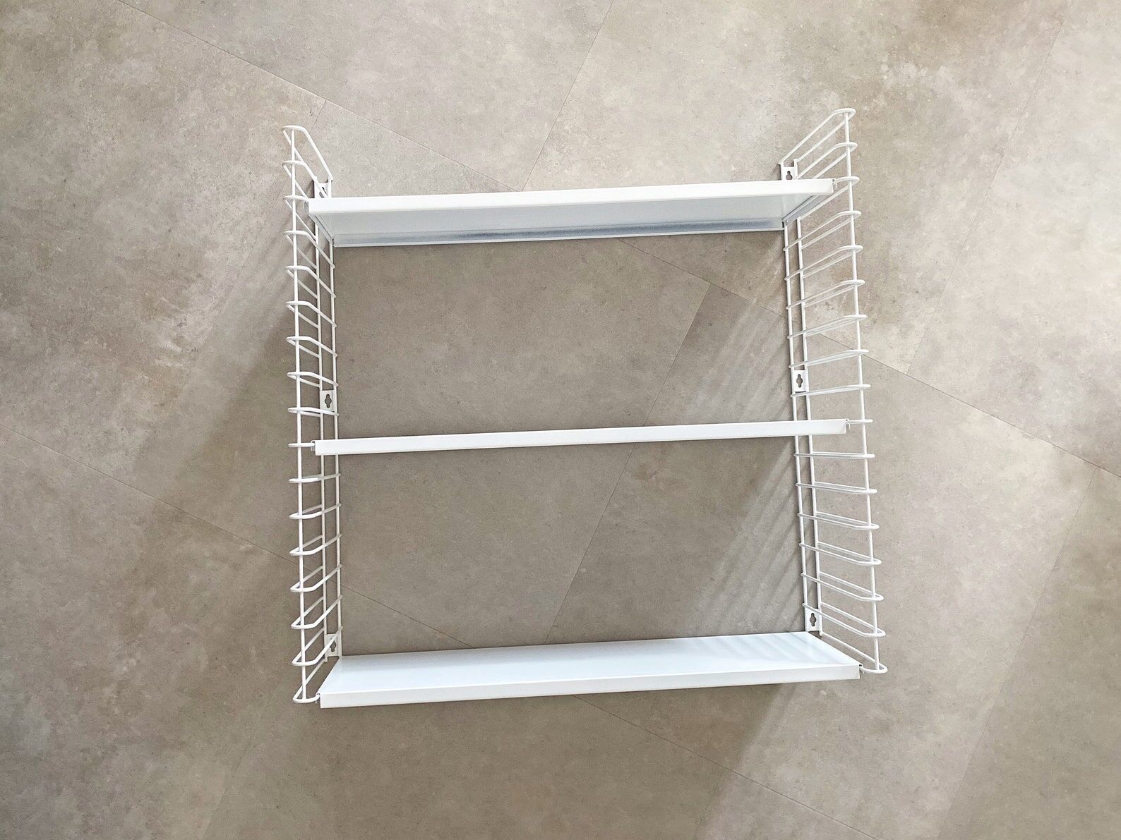Tomado wall shelves designed by D. Dekker for TOMADO