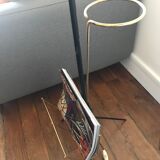 Vintage lamp holder wears magazines and wears black and brass plants