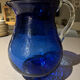 Vintage cobalt blue blown glass jug with a transparent handle.