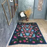 Handwoven floral wool rug, black background with pink roses and geometric design 207x144cm