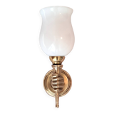 Golden brass wall light from the 1950s.