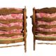 pair of rustic wood and fabric armchairs