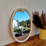 Vintage enamelled metal oval mirror