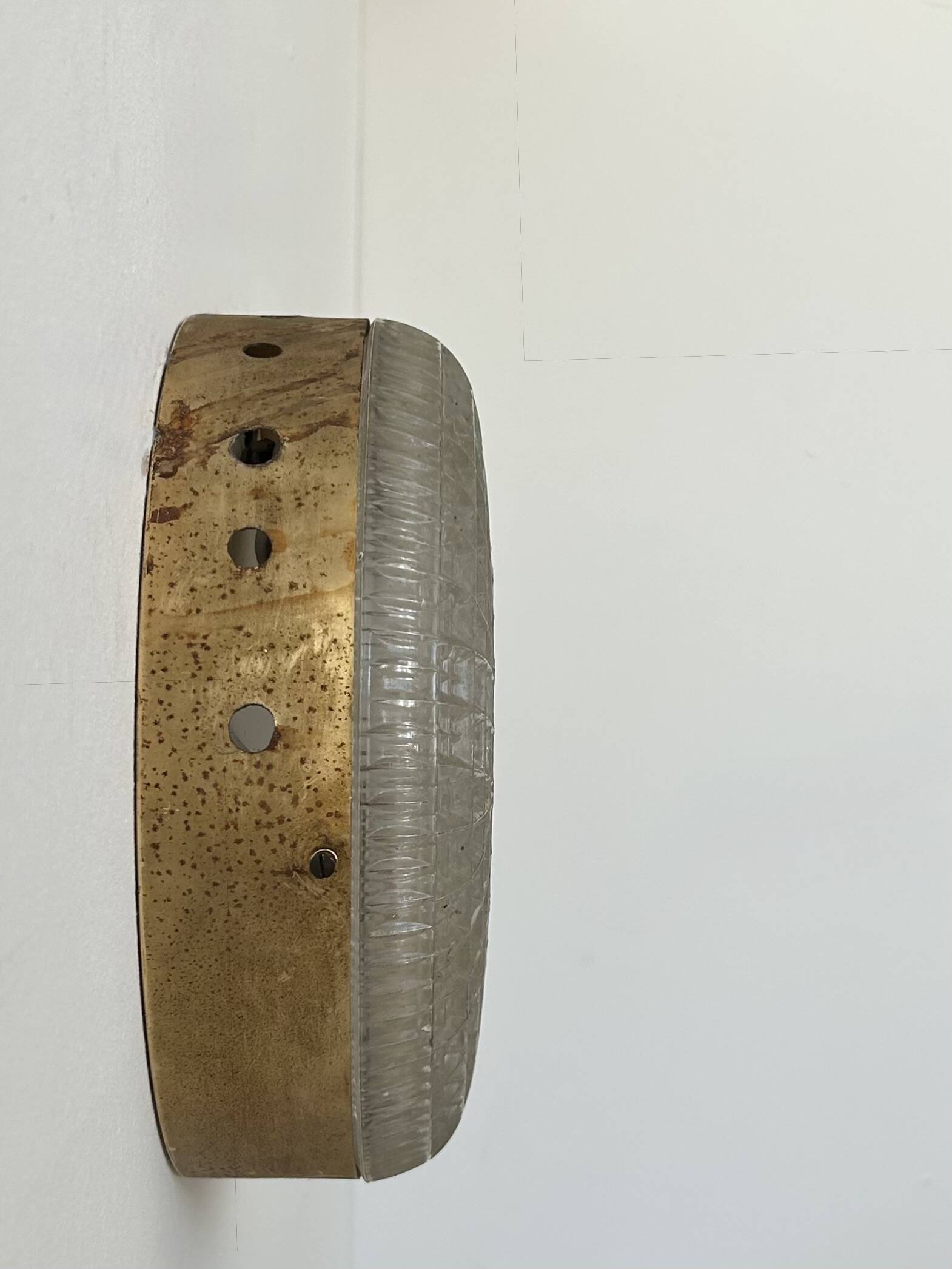Pair of vintage wall lights in gilded metal and pressed moulded glass, France, 1970.