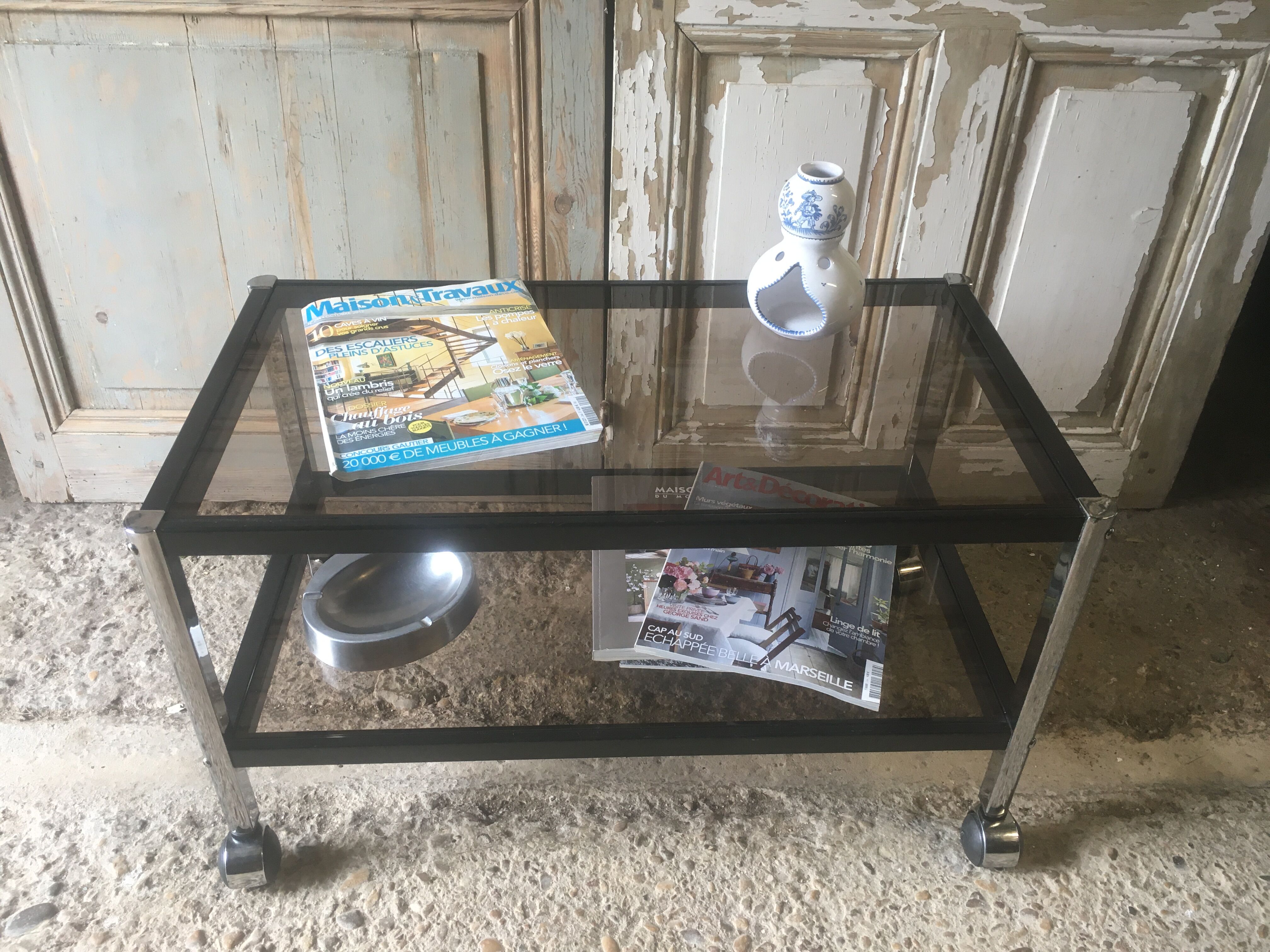 Metal coffee table with smoked glass.