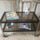 Metal coffee table with smoked glass.