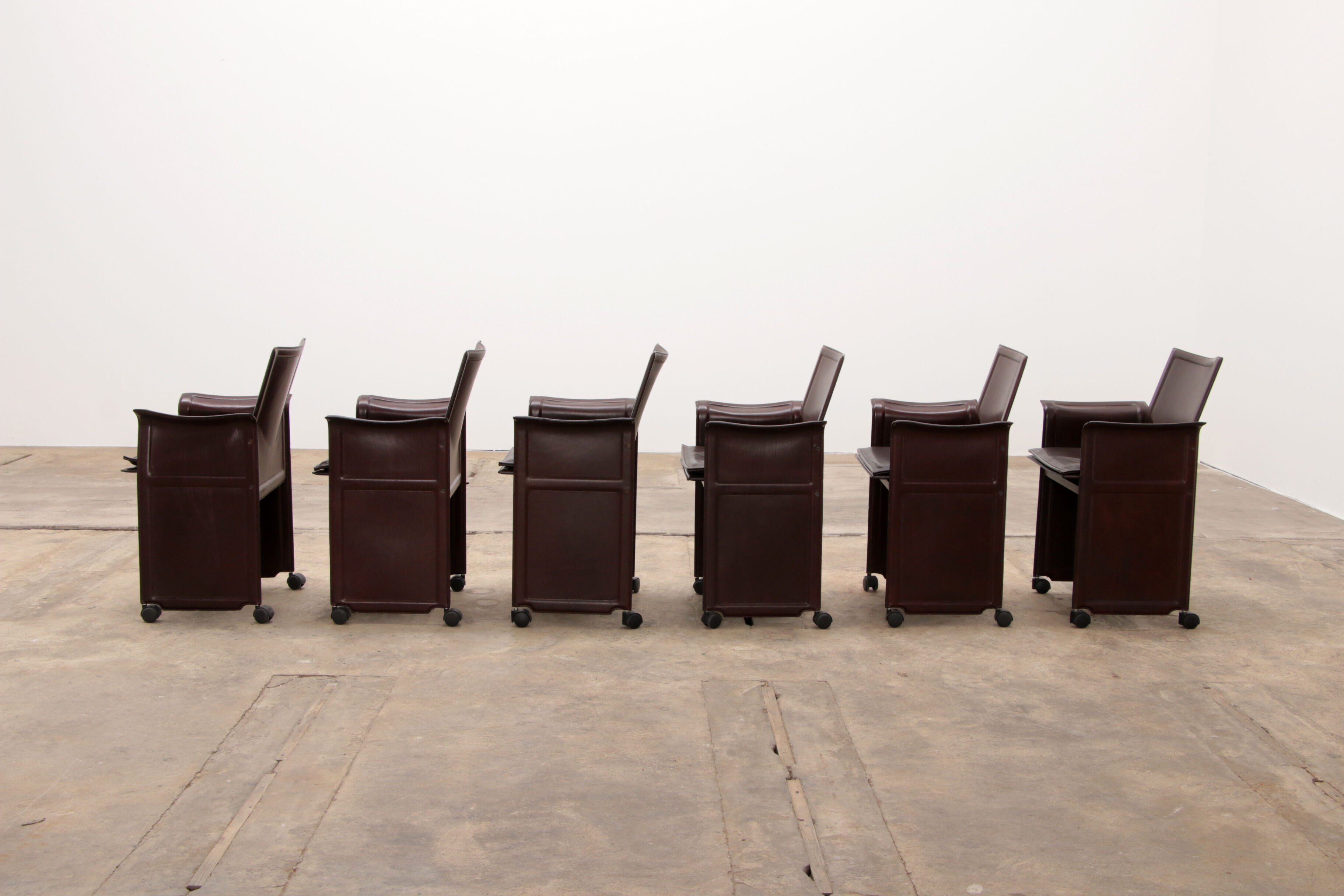 Tito Agnoli for Matteo Grassi leather dining table and six chairs
