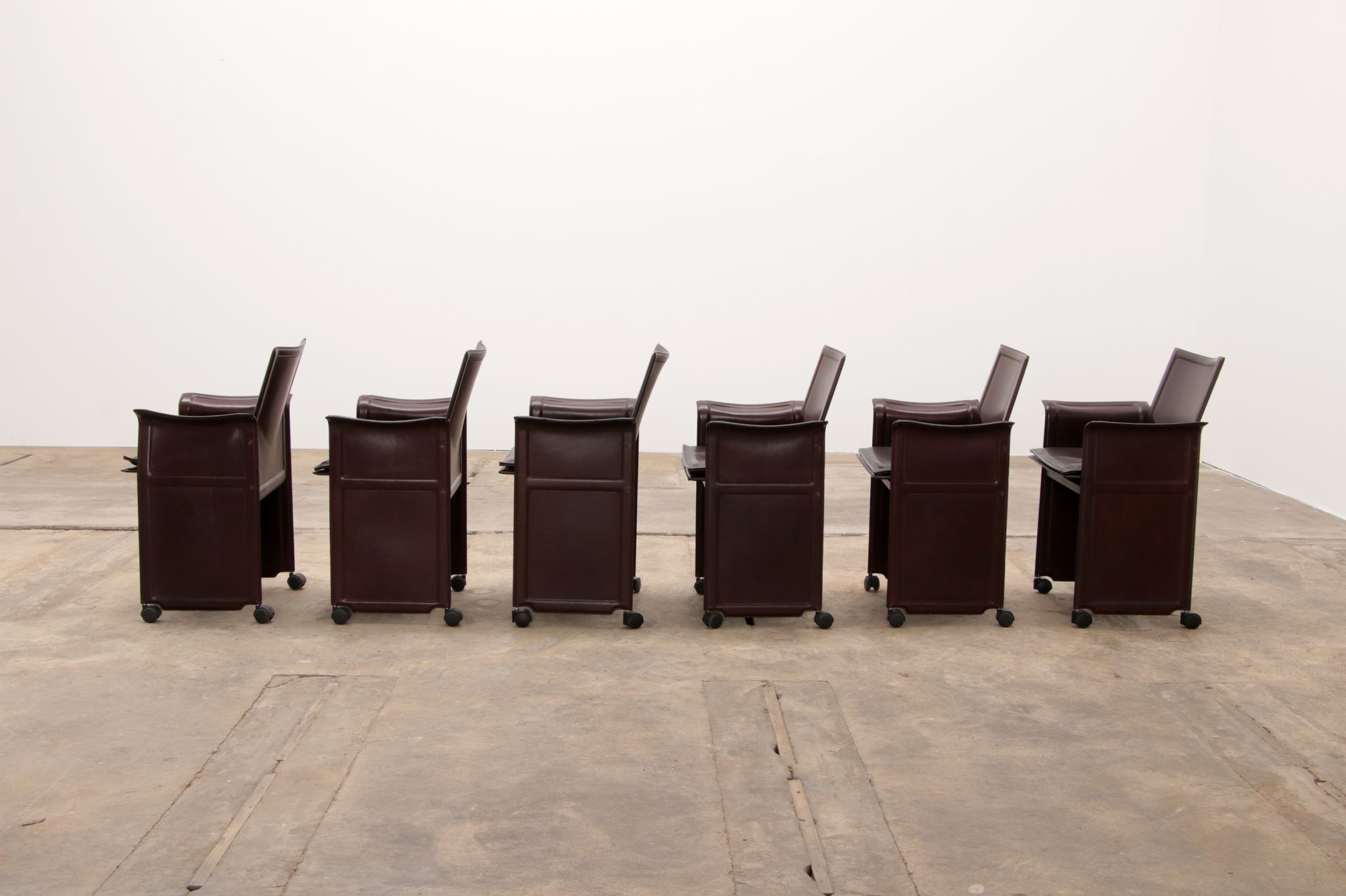 Tito Agnoli for Matteo Grassi leather dining table and six chairs