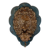 Patinated bronze holy water font