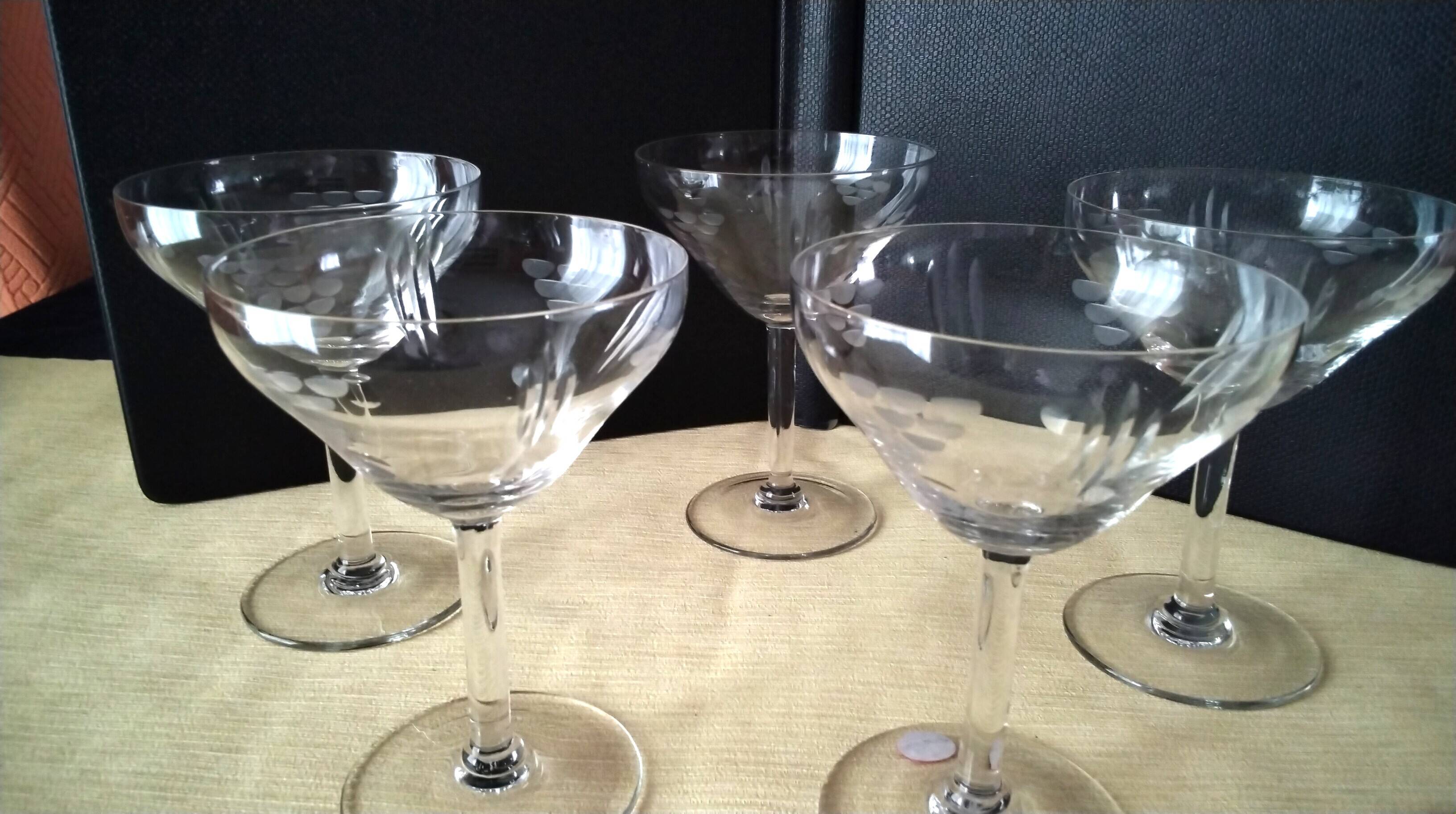 5 Vintage glass champagne coupes with engraved decoration