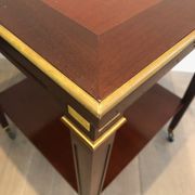 Two-level table in mahogany and brass