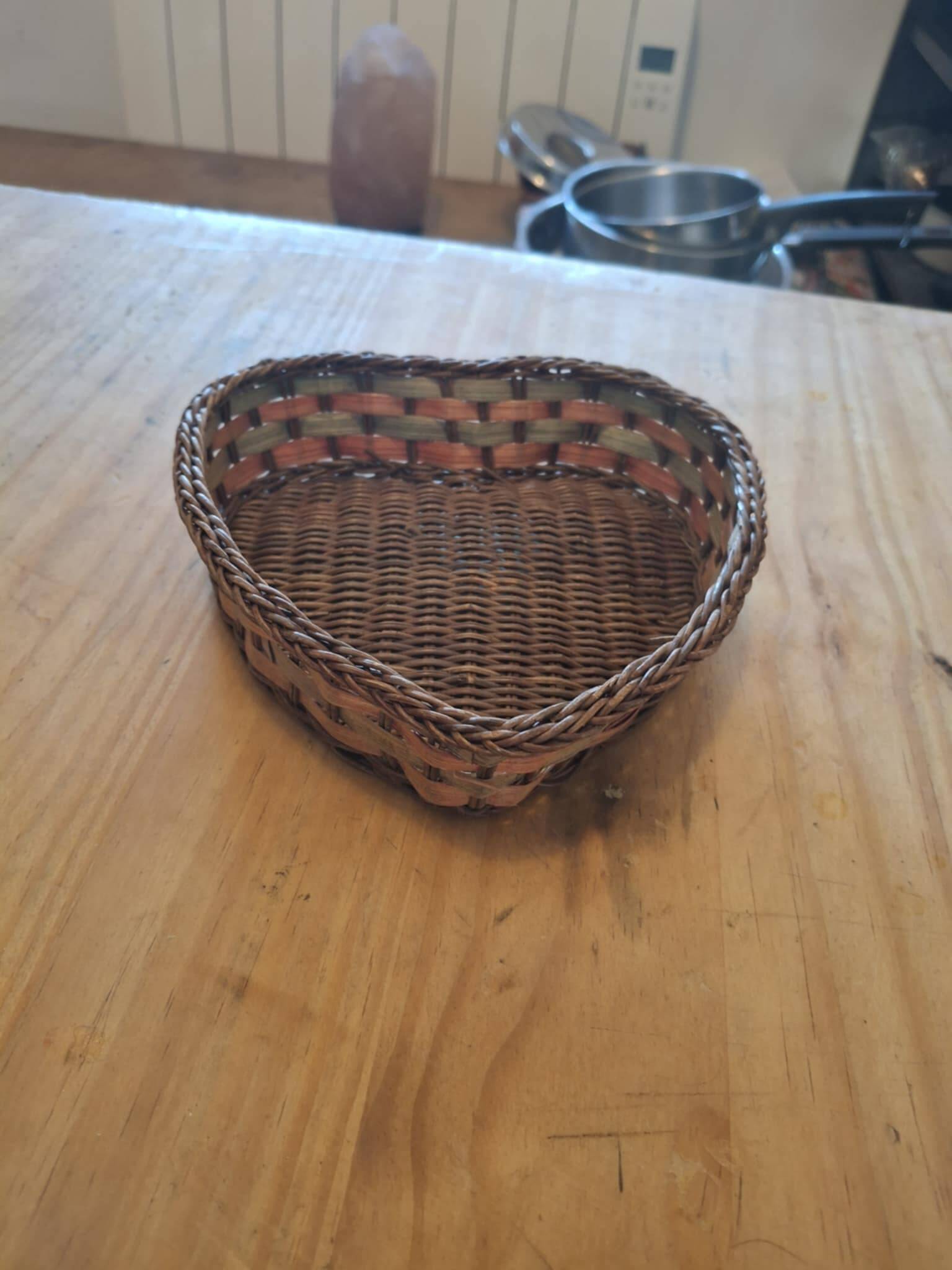 Small wicker basket in the shape of a heart.