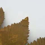 Old sun mirror with foliage in gilded metal with twisted frieze from the 60s