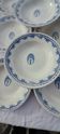 8 hollow plates in F J earthenware with frieze and central bouquet