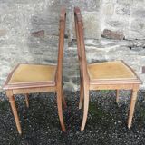 Pair of old chairs with brass elements