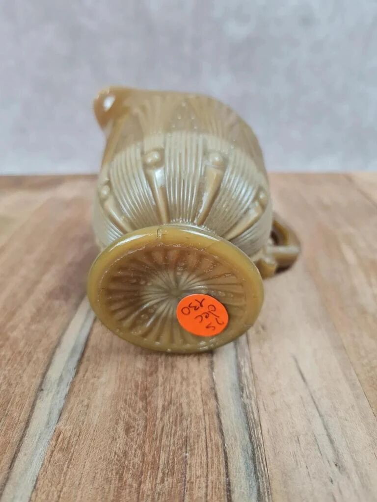 Small antique pressed glass jug in honey colour – moulded decoration