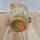 Small antique pressed glass jug in honey colour – moulded decoration