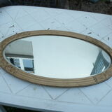 Miroir biseauté art déco en bois et stuc doré 66x39cm