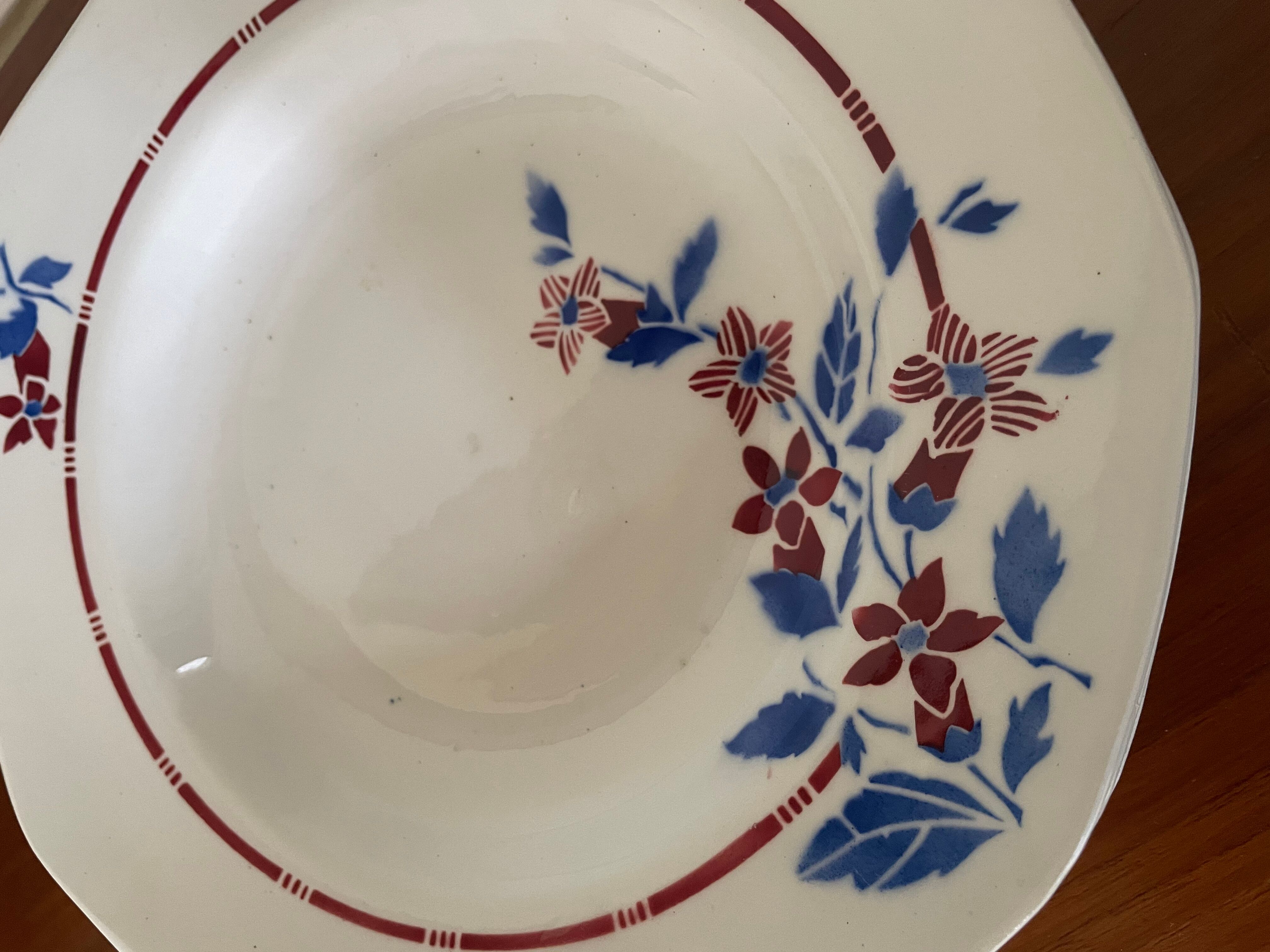 Saint Amand hollow plates decorated with red and blue flowers