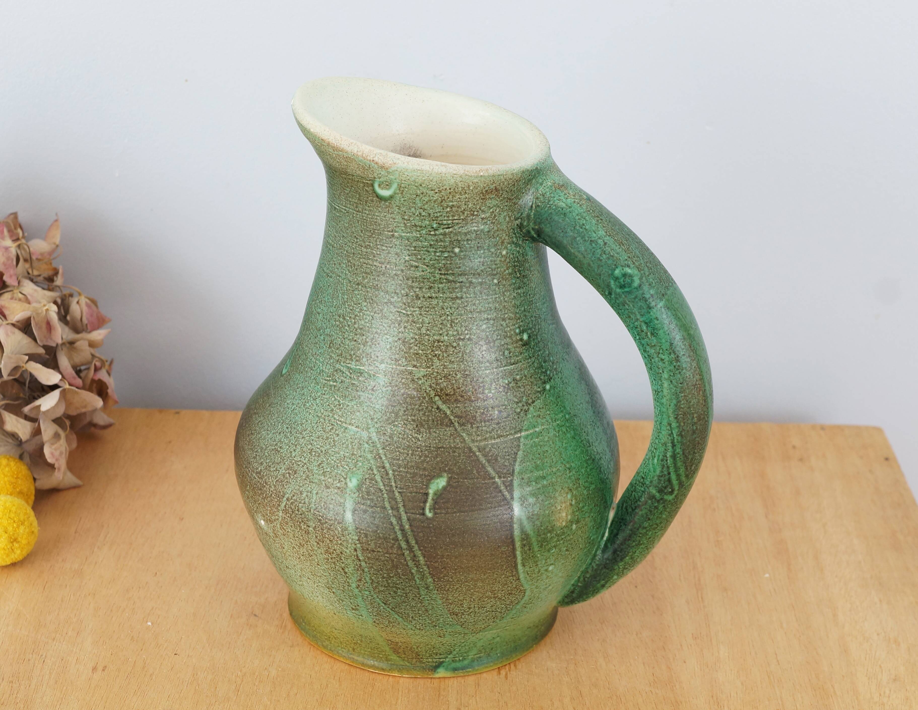 Ceramic jug enamelled in shades of green, signed, vintage