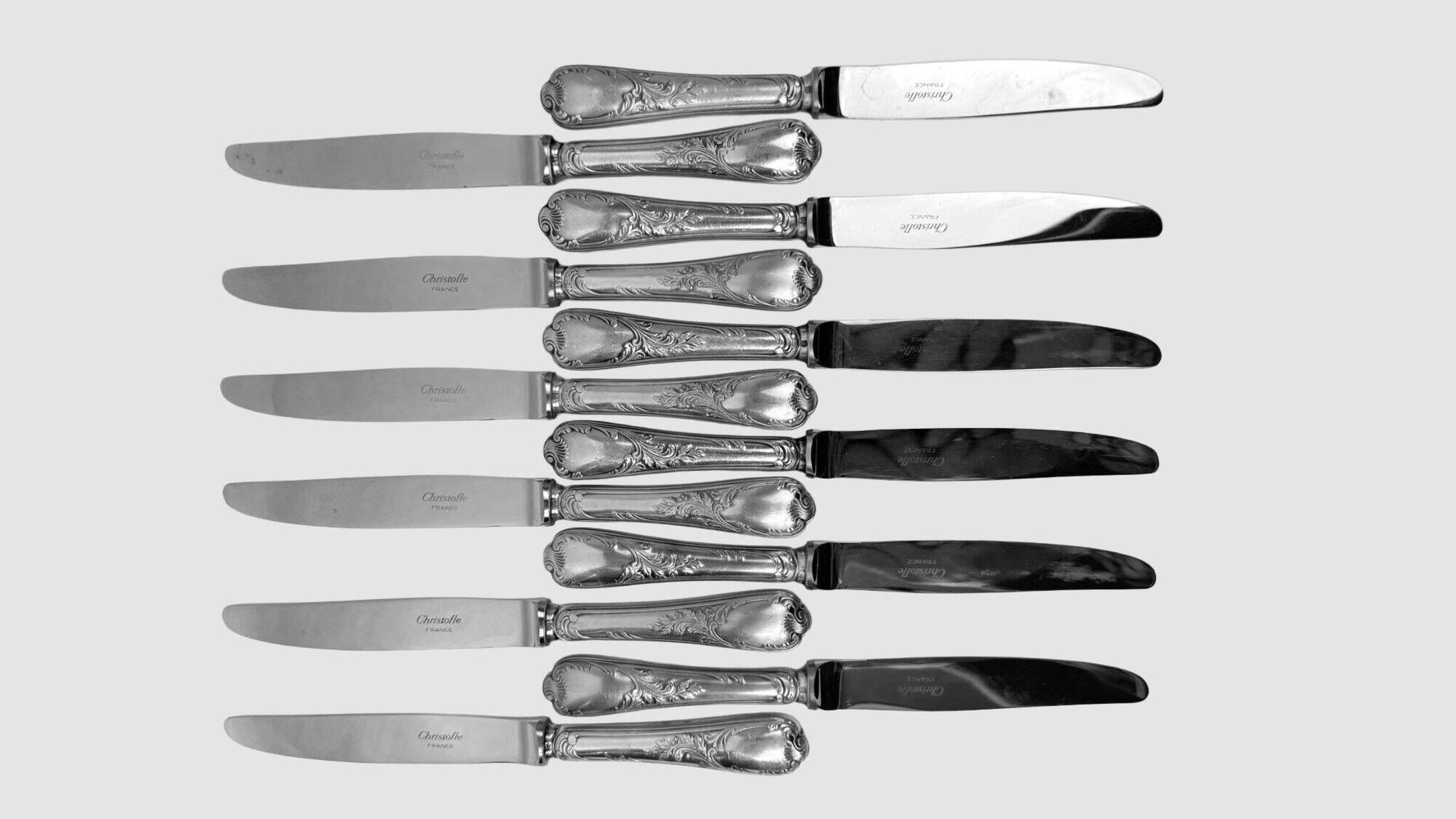 Twelve Christofle Marly table knives, silver-plated metal handles.