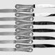 Twelve Christofle Marly table knives, silver-plated metal handles.
