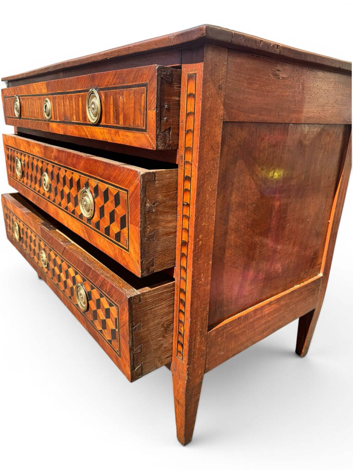Louis XVI commode with marquetry featuring a design of precious wood cubes, 18th century.