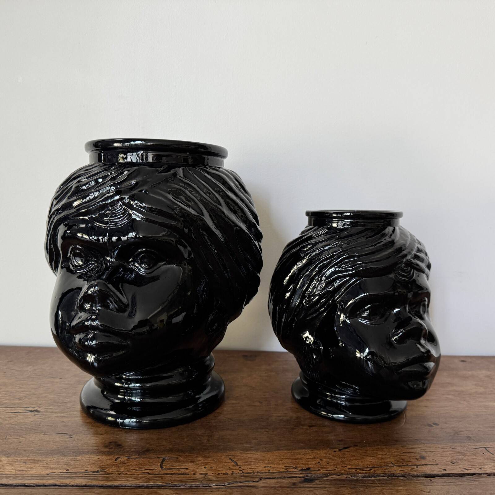 2 glass heads representing Moors