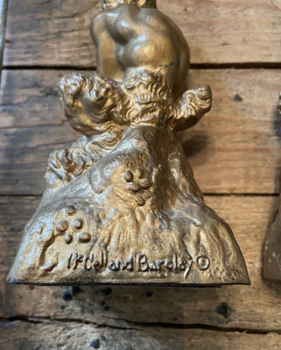 2 Seated satyr sculptures in cast bronze