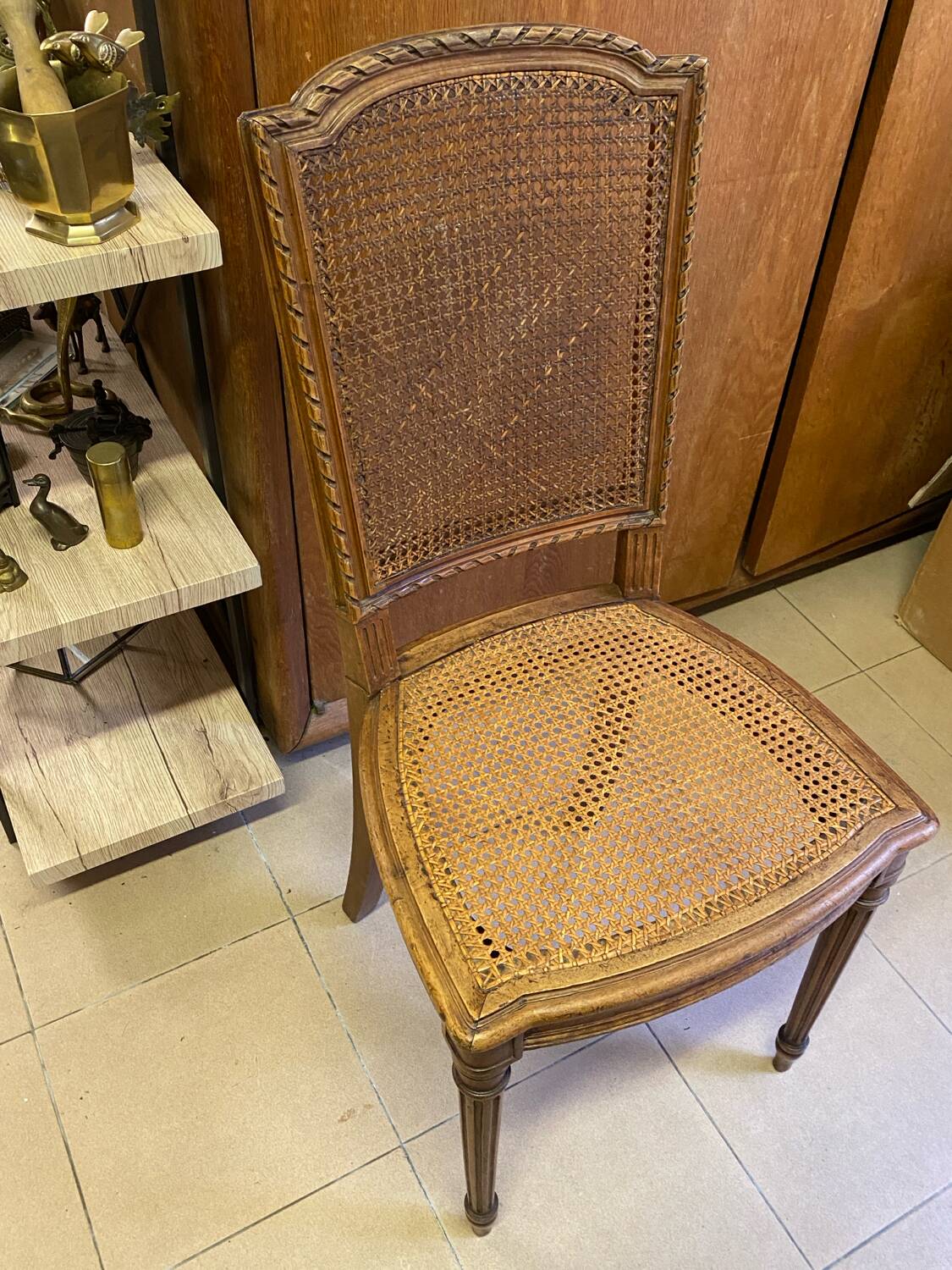 Chair with caned seat and back made of wood