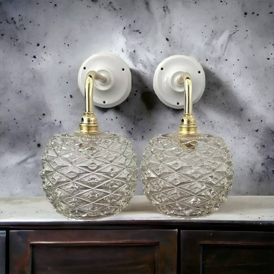 Pair of chiseled glass wall sconces