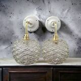 Pair of chiseled glass wall sconces