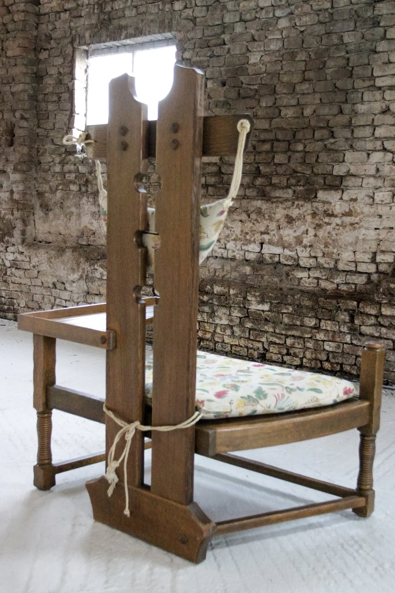 Rare Dutch brutalist oak armchair with integrated side table – 1950s