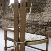 Rare Dutch brutalist oak armchair with integrated side table – 1950s