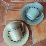 A pair of vintage glazed stoneware cups and saucers.